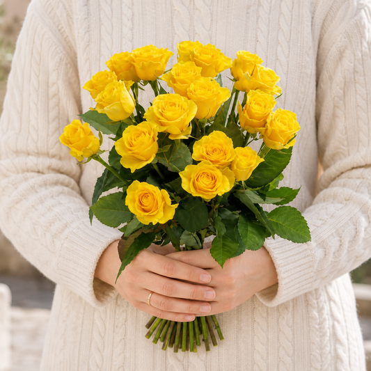 Person holding the ALWAYS bouquet outdoors, torso only without face