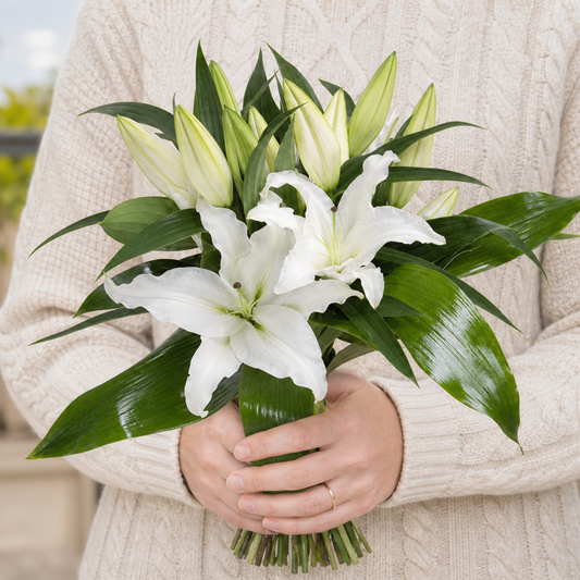 Person holding the BRIGHT bouquet outdoors, torso only without face