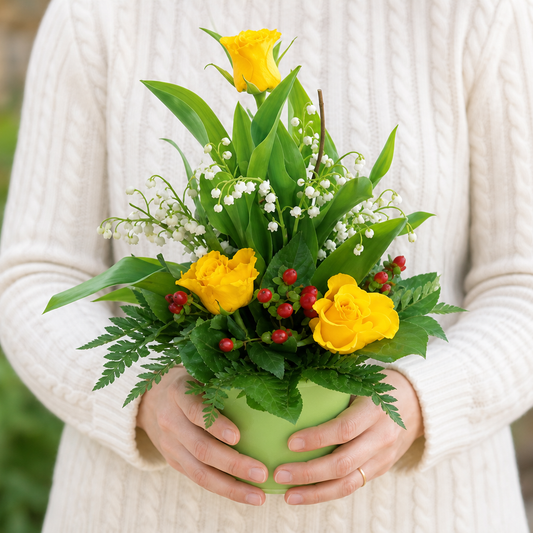 Person holding the ELOQUENCE bouquet outdoors, torso only without face