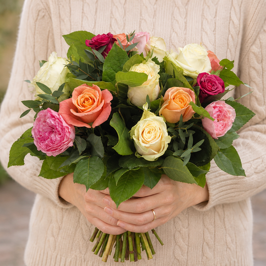 Person holding the EXPLOSIVE bouquet outdoors, torso only without face