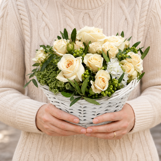 Person holding the FOR YOU bouquet outdoors, torso only without face