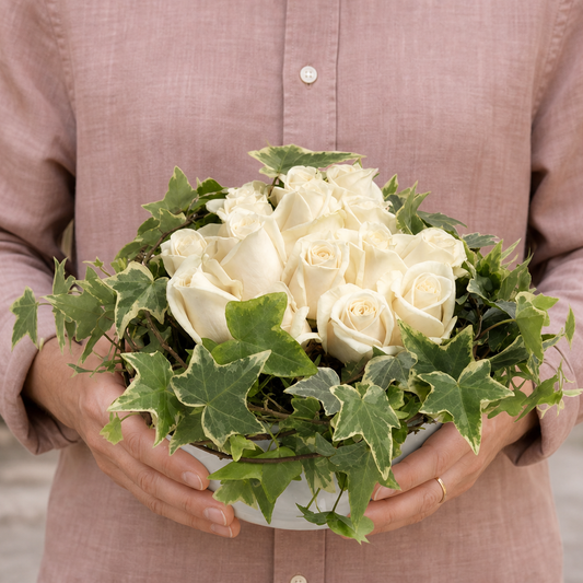 Person holding the MAGNIFICENT bouquet outdoors, torso only without face