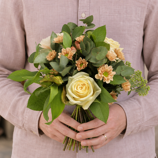 Person holding the VIBRANT bouquet outdoors, torso only without face
